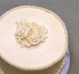 Lemon buttercream, lemon syrup soaked lemon cake, and lemon cream filling make this a perfectly sweet birthday cake.
